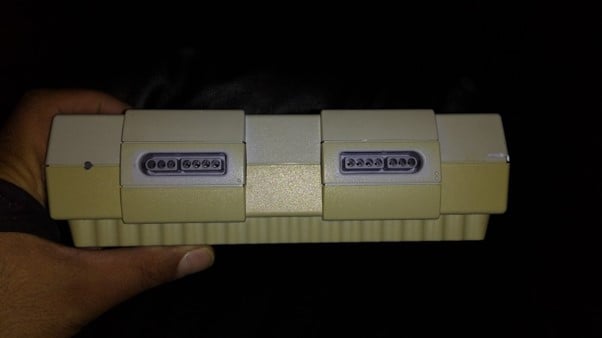 Front View of a Yellow SNES Retro Console